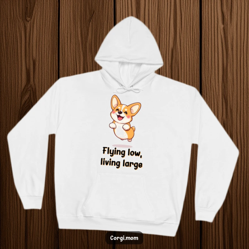 Funny Corgi with large ears mid-jump, depicted on a warm and cozy hoodie, ready for adventure.